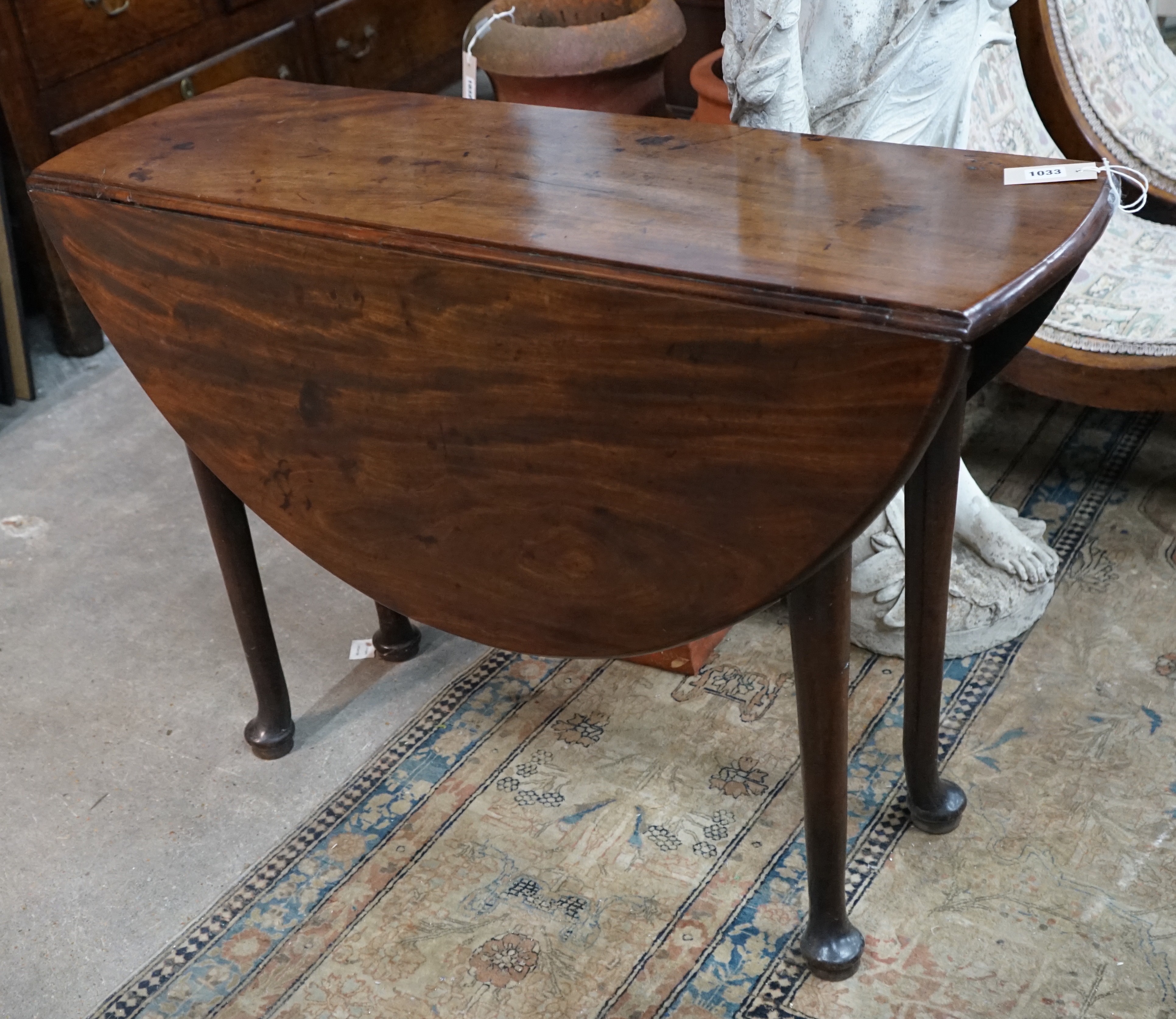 A George III mahogany padfoot drop leaf dining table, length 108cm extended, width 99cm, height 71cm